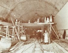 Workmen tiling the Rotherhithe Tunnel, London, December 1907