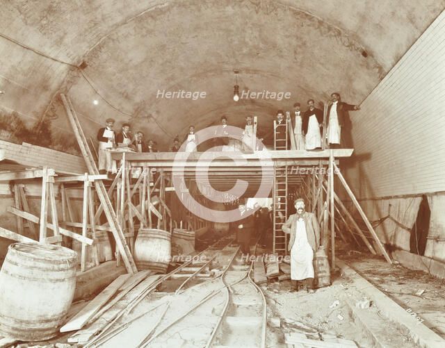Workmen tiling the Rotherhithe Tunnel, London, December 1907. Artist: Unknown.