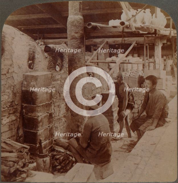 'Workmen watching kilns of precious Awata porcelain, in Kinkosan works, Kyoto, Japan', 1904.  Artist: Unknown.