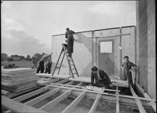 Workmen assembling a Swedish prefabricated house, 1945. Creator: Ministry of Works
