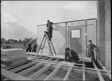 Workmen assembling a Swedish prefabricated house, 1945. Creator: Ministry of Works