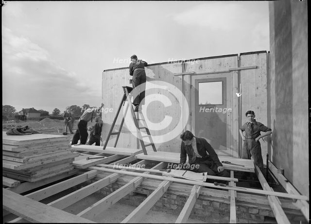 Workmen assembling a Swedish prefabricated house, 1945. Creator: Ministry of Works.
