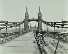 Workmen on old Chelsea Bridge, London, 1921