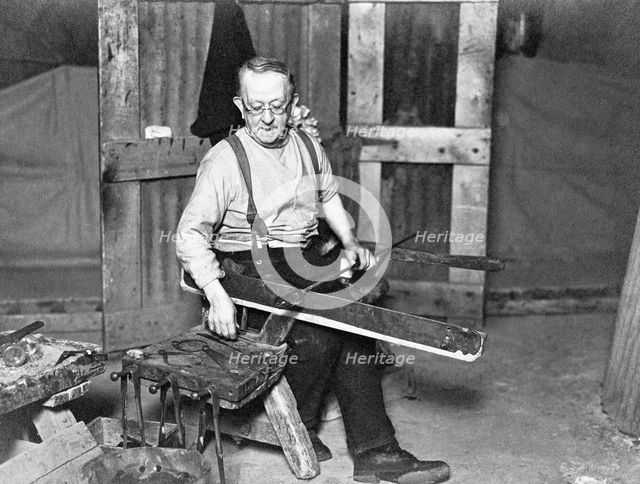 Worker at Whitefriars Glassworks, City of London, (early 20th century?).  Creator: Unknown.