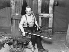 Worker at Whitefriars Glassworks, City of London, (early 20th century?). Creator: Unknown