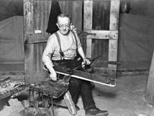 Worker at Whitefriars Glassworks, City of London, (early 20th century?). Creator: Unknown