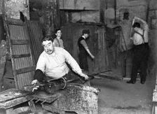 Worker at Whitefriars Glassworks, City of London, (early 20th century?). Creator: Unknown