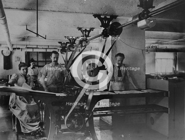 Workers in the postage stamp gumming and drying room in the Stamp Division..., ca 1895. Creator: Frances Benjamin Johnston.