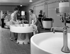 Workers in the washroom facility at a steelworks, Rotherham, South Yorkshire, 1964. Creator: Michael Walters