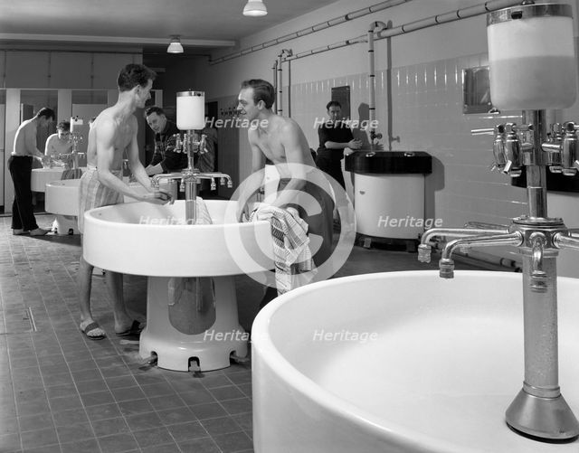Workers in the washroom facility at a steelworks, Rotherham, South Yorkshire, 1964. Creator: Michael Walters.