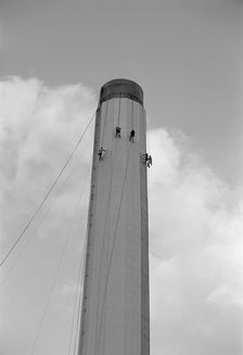 Workers painting an industrial chimney, Hackney, London, 1965. Artist: Laurence Goldman
