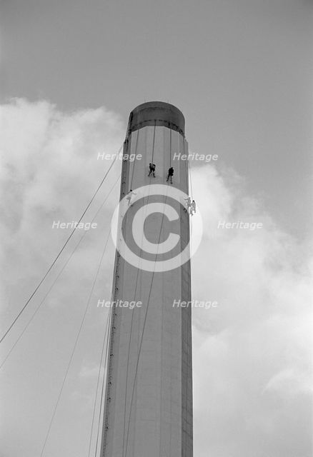 Workers painting an industrial chimney, Hackney, London, 1965. Artist: Laurence Goldman.