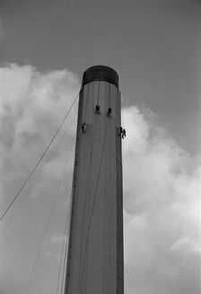 Workers painting an industrial chimney, Hackney, London, 1965. Artist: Laurence Goldman