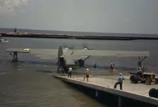 Working with a sea-plane at the Naval Air Base, Corpus Christi, Texas, 1942. Creator: Howard Hollem