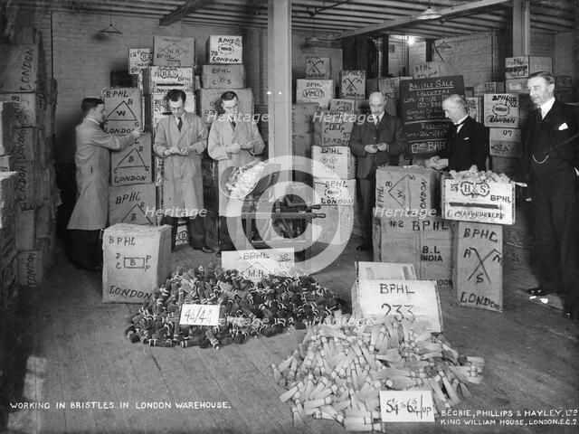 Working with bristles in a warehouse, London, 1938. Artist: Unknown