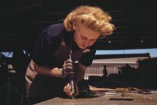 Working in the Assembly and Repair Dept. of the Naval Air Base, Corpus Christi, Texas, 1942. Creator: Howard Hollem