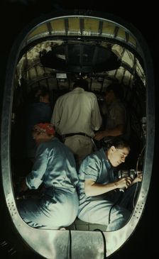 Working inside fuselage of a Liberator Bomber, Consolidated Aircraft Corp., Fort Worth, Texas, 1942. Creator: Howard Hollem