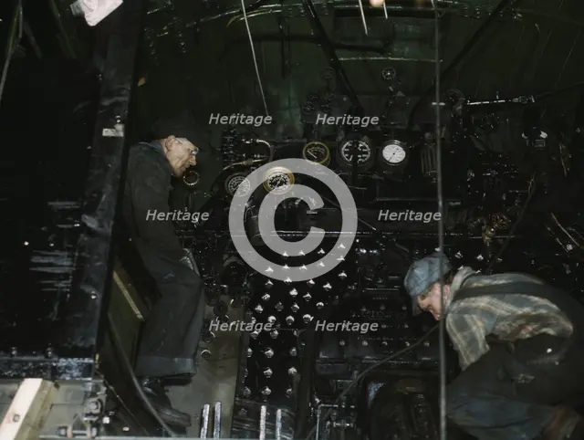 Working on the cab of a locomotive brought in for repair at the C & NW RR, Chicago, Ill., 1942. Creator: Jack Delano.