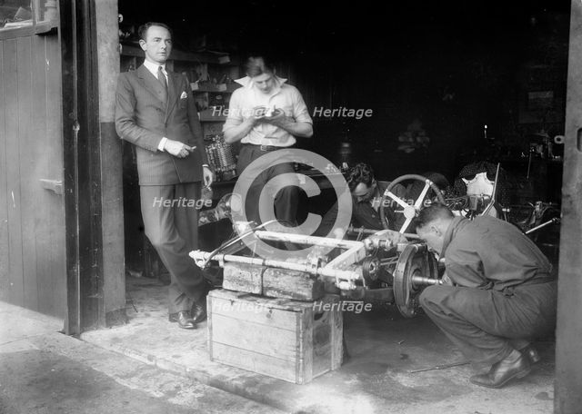 Working on the chassis of Raymond Mays' 2996 cc Vauxhall-Villiers. Artist: Bill Brunell.