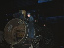 Working on the boiler of a locomotive at the 40th Street shops of the C & NW RR, Chicago, Ill., 1942 Creator: Jack Delano