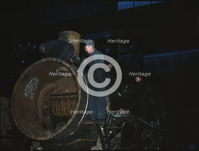 Working on the boiler of a locomotive at the 40th Street shops of the C & NW RR, Chicago, Ill., 1942 Creator: Jack Delano.