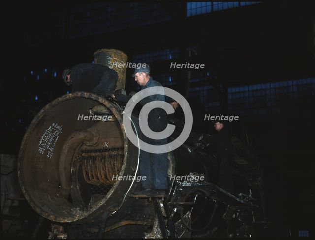 Working on the boiler of a locomotive at the 40th Street shops of the C & NW RR, Chicago, Ill., 1942 Creator: Jack Delano.