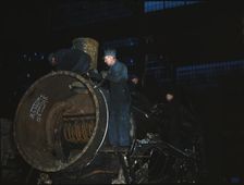 Working on the boiler of a locomotive at the 40th Street shops of the C & NW RR, Chicago, Ill., 1942 Creator: Jack Delano