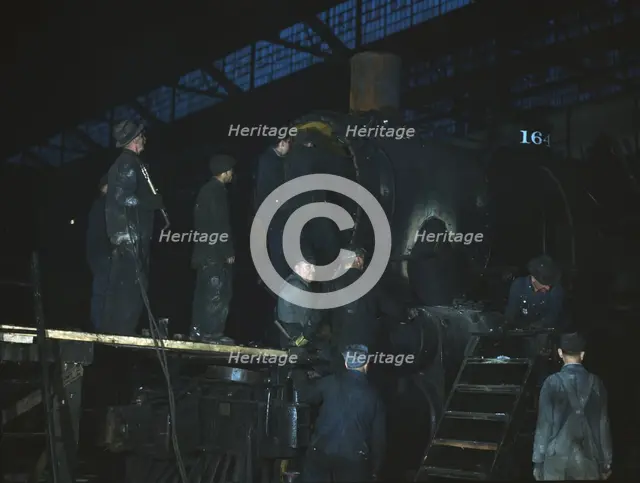 Working on a locomotive at the 40th Street shop of the C & NW RR, Chicago, Ill., 1942. Creator: Jack Delano.
