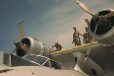 Working on a plane at the Naval Air Base, Corpus Christi, Texas, 1942. Creator: Howard Hollem