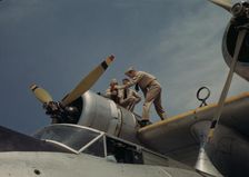 Working on a plane at the Naval Air Base, Corpus Christi, Texas, 1942. Creator: Howard Hollem