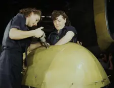 Working on a "Vengeance" dive bomber, Vultee [Aircraft Inc.], Nashville, Tennessee, 1943. Creator: Alfred T Palmer
