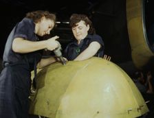 Working on a "Vengeance" dive bomber, Vultee [Aircraft Inc.], Nashville, Tennessee, 1943. Creator: Alfred T Palmer