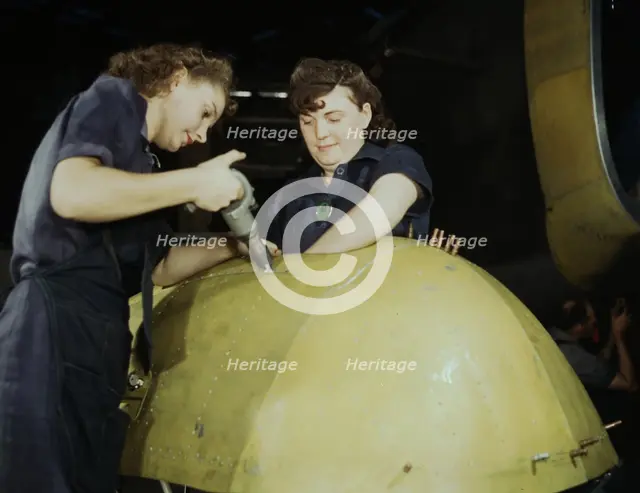 Working on a "Vengeance" dive bomber, Vultee [Aircraft Inc.], Nashville, Tennessee, 1943. Creator: Alfred T Palmer.