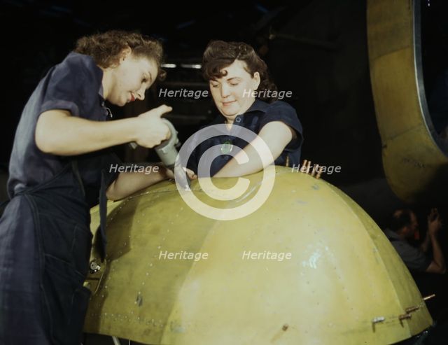 Working on a "Vengeance" dive bomber, Vultee [Aircraft Inc.], Nashville, Tennessee, 1943. Creator: Alfred T Palmer.