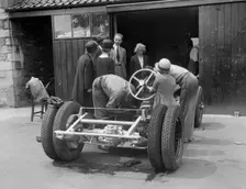 Working on Raymond Mays Vauxhall-Villiers, c1930s. Artist: Bill Brunell