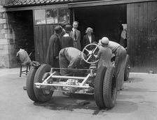 Working on Raymond Mays Vauxhall-Villiers, c1930s. Artist: Bill Brunell