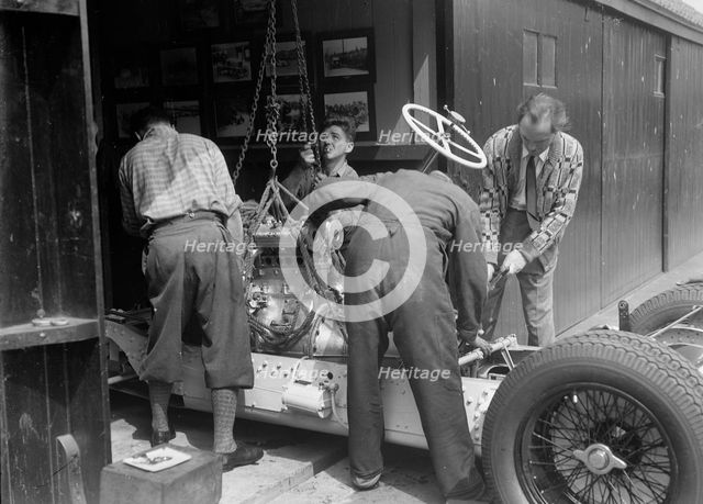 Working on Raymond Mays' Vauxhall-Villiers, c1930s. Artist: Bill Brunell.