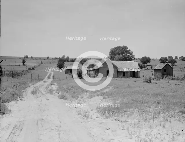 Worn-out land and abandoned cabins near Newport, Oklahoma, 1937. Creator: Dorothea Lange.