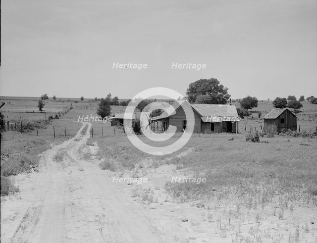 Worn-out land and abandoned cabins near Newport, Oklahoma, 1937. Creator: Dorothea Lange.