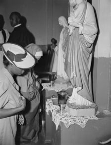 Worshippers before the altar in the St. Martin's Spiritual Church, Washington, D.C., 1942. Creator: Gordon Parks