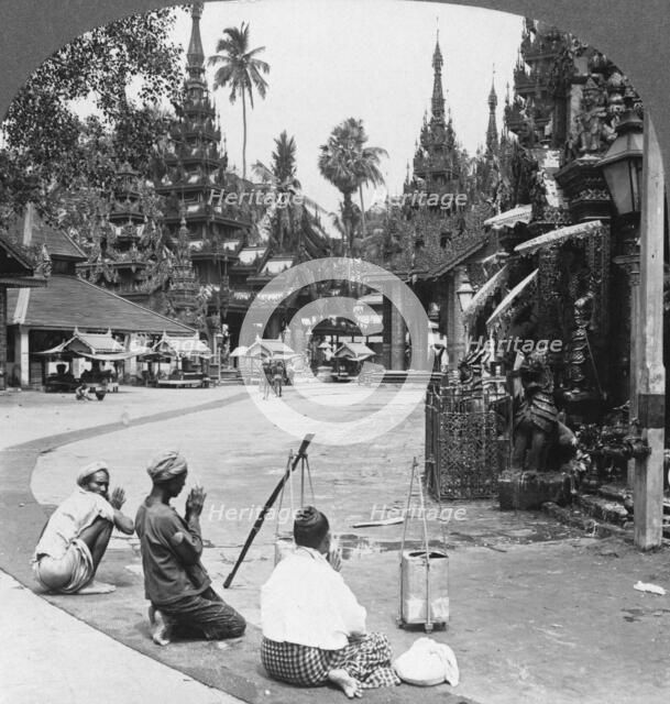 Worshipping before an idol, Shwedagon Pagoda, Rangoon, Burma, 1908. Artist: Stereo Travel Co