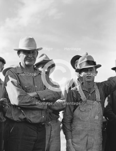 Watching ball game, Shafter camp for migrants, California, 1938. Creator: Dorothea Lange.
