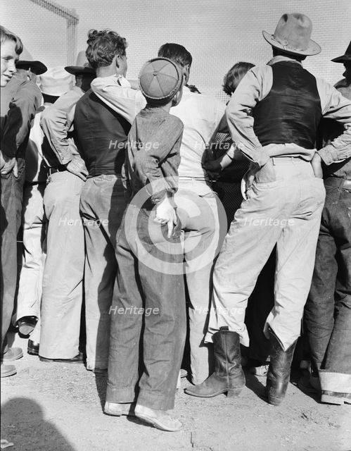 Watching ball game, Shafter migrant camp, California, 1938. Creator: Dorothea Lange.