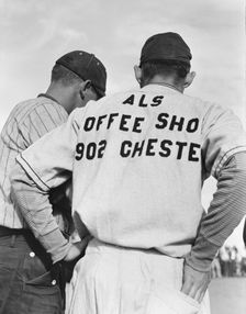 Watching ball game, Shafter migrant camp, California, 1938. Creator: Dorothea Lange