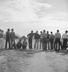 Watching ball game, Shafter migrant camp, California, 1938. Creator: Dorothea Lange