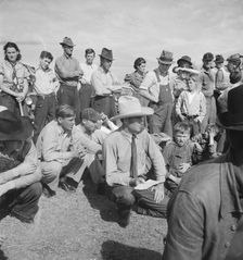 Watching ball game, Shafter migrant camp, California, 1938. Creator: Dorothea Lange