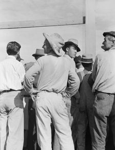 Watching ball game, Shafter migrant camp, California, 1939. Creator: Dorothea Lange