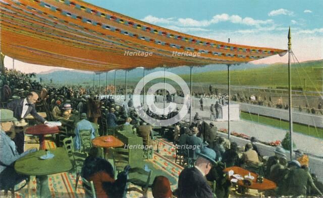'Watching the Races in front of Club House, Agua Caliente Jockey Club', c1939. Artist: Unknown.