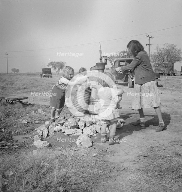 Water supply, Migratory camp for cotton pickers, San Joaquin Valley, California, 1936. Creator: Dorothea Lange.