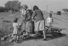 Water supply, American River camp, California, San Joaquin Valley, CA, 1936. Creator: Dorothea Lange